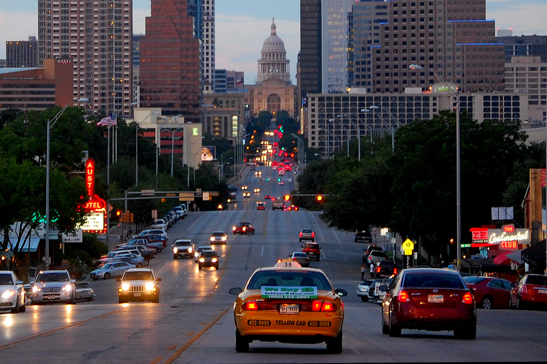 Real photograph of Congress Avenue in downtown Austin, Texas, photographed July 2010; archival venue area photo, not the 2026 parade.
