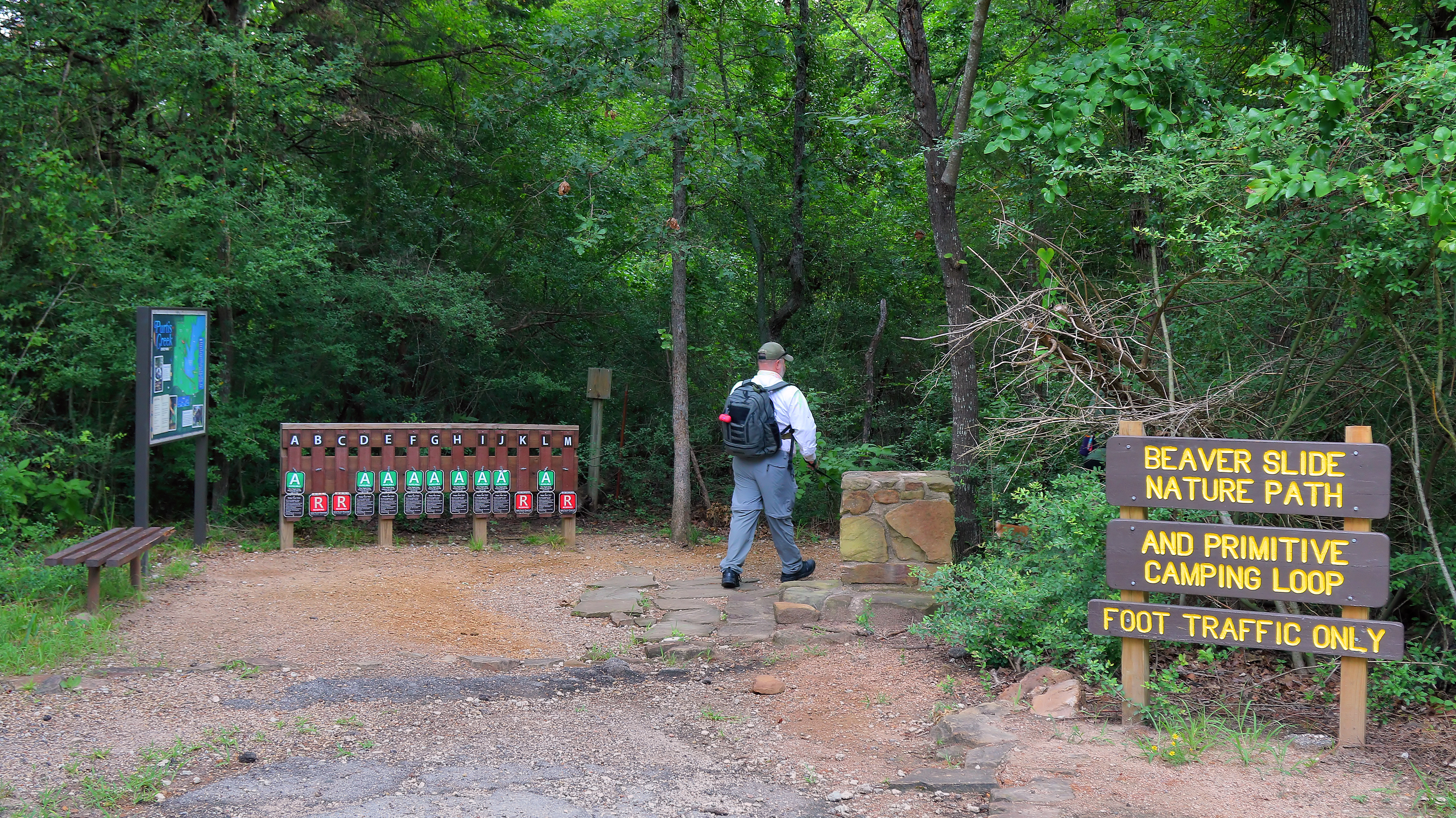 Actual hiker at Beaver Slide Nature Path in Purtis Creek State Park, Texas, 2025. Archival daytime location photograph, not Friday's event.