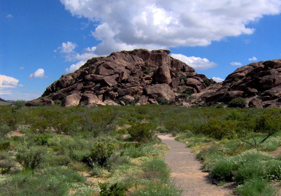 True archival photograph of East Mountain rock formations at Hueco Tanks State Park near El Paso, Texas; image does not depict 2026 volunteers.