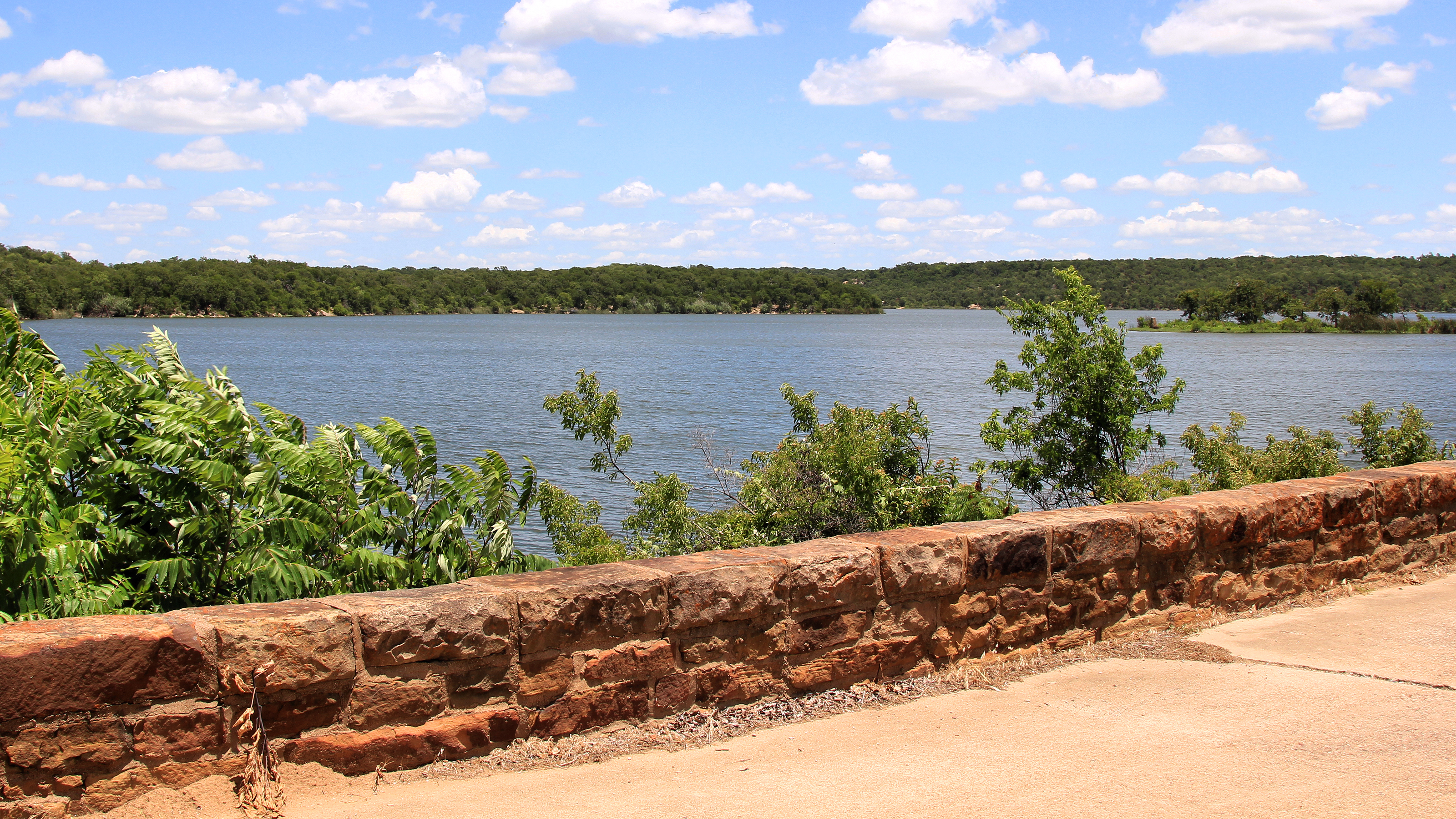 Lake Mineral Wells as seen from the Texas state park near the spillway, with water and wooded shoreline.